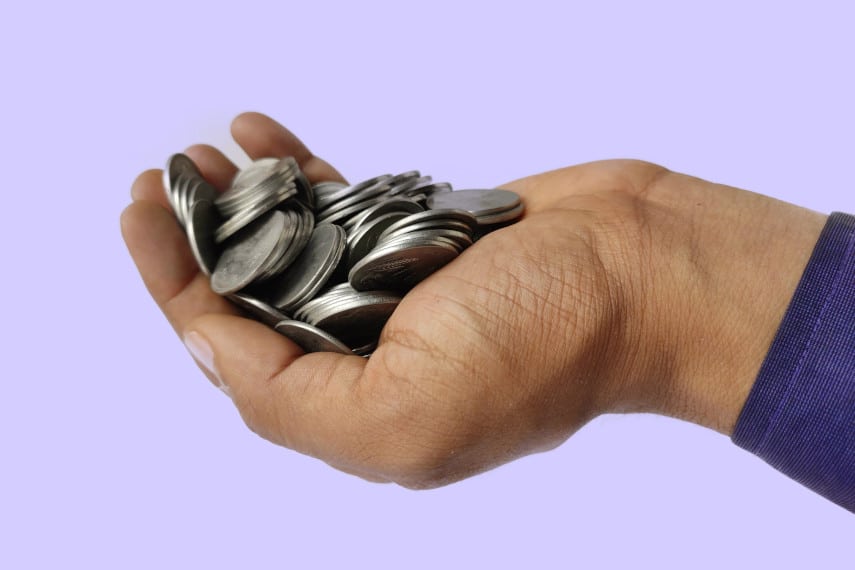 silver coins in the hand